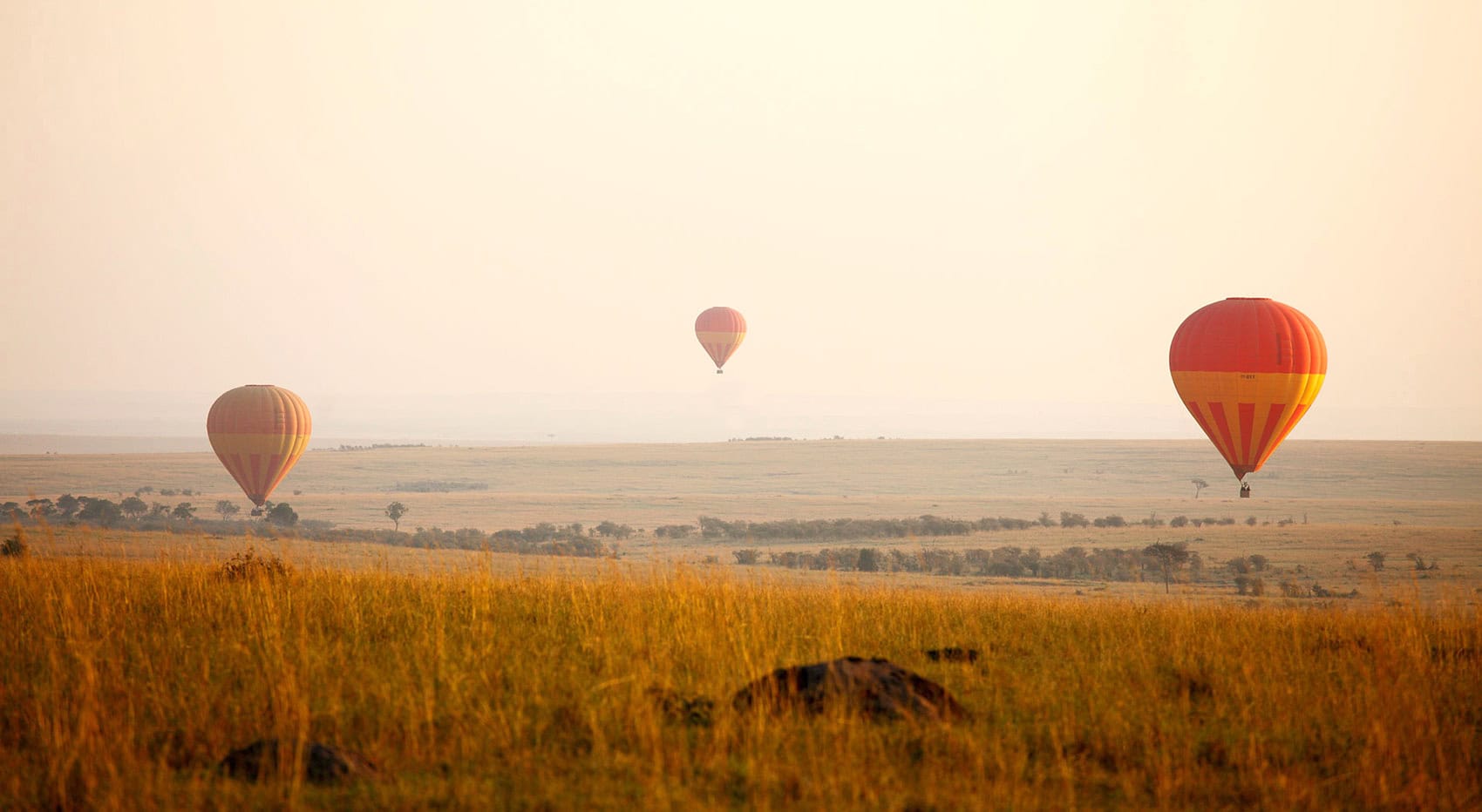 Drei Heißluftballons über der Masai Mara. Drei Heißluftballons über der Masai Mara.